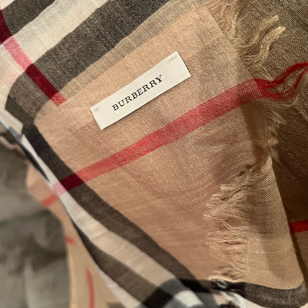 Burberry scarf. Signature plaid design. Measures 84”X 29”